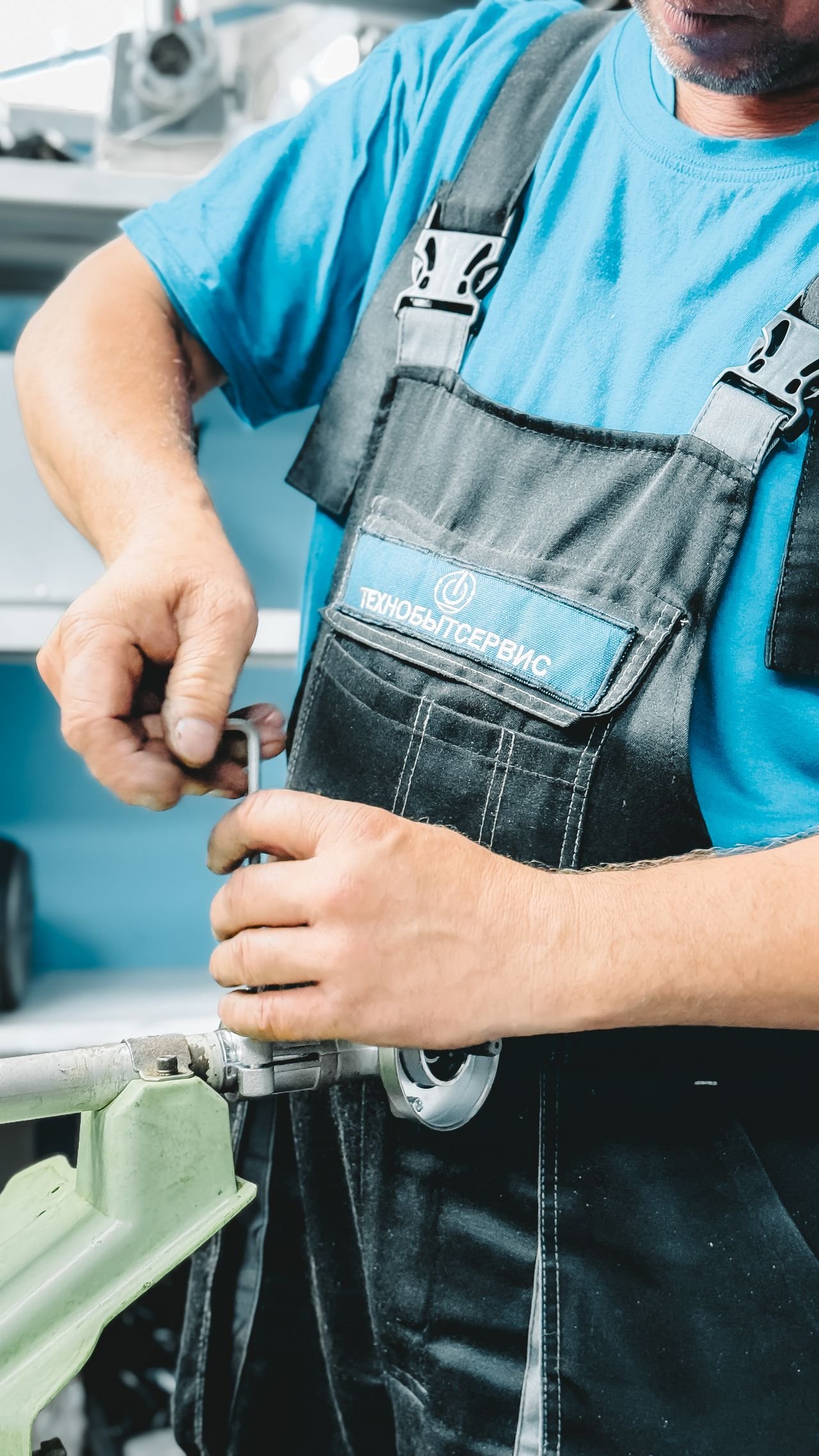 Emergency plumber working under a sink in a Portland home